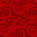 濃い赤を基調とした唐草模様の背景パターン