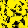黒背景に黄色のインクが飛び散るパターン